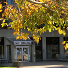 entrance to MIT Medical with autumn leaves in the foreground